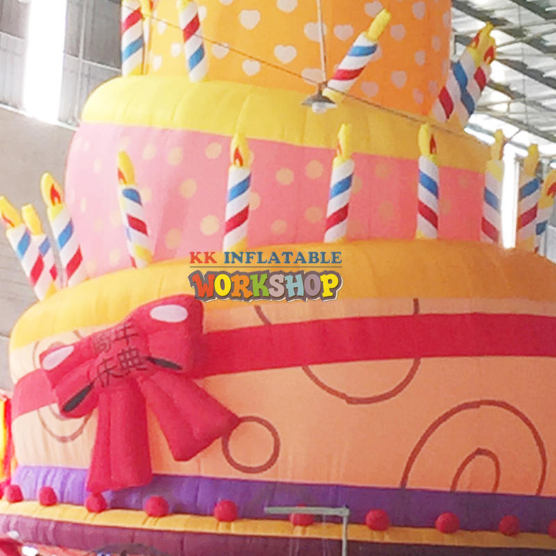 giant inflatable birthday cake with candles