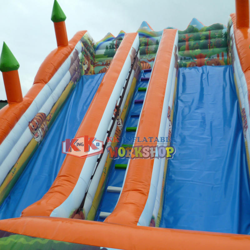 Made in China large children's Jungle theme inflatable double slide, forest jumping castle dry slide